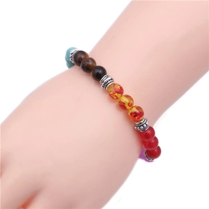 Antique silver tiger eye and colorful agate beaded yoga bracelet worn on a female wrist