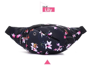 Close-up of waterproof running waist bag featuring a pink lily floral print and earphone hole