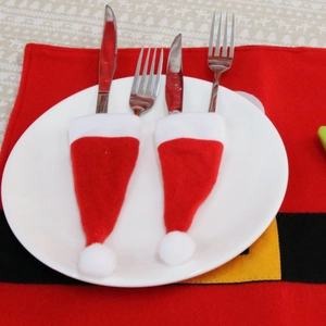 Red and white brushed fabric Christmas hat cutlery holders for holiday table decor