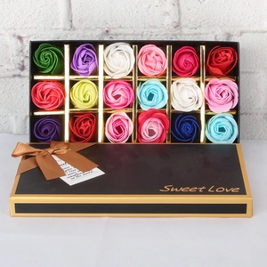 Detail of 18 colorful soap roses in a black gift box with Sweet Love gold lettering