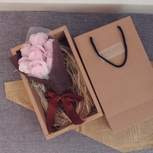 Detailed top view of pink soap rose bouquet in a kraft gift box with a handmade carry bag