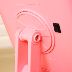 Detail of pink LED makeup mirror base with a black power rocker switch on the stand