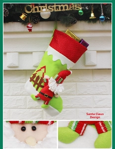 Detail of a green velvet Christmas stocking featuring 3D Santa and festive tree appliques