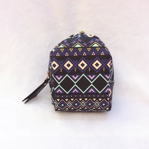 Ethnic style mini backpack coin purse with colorful geometric patterns in black canvas