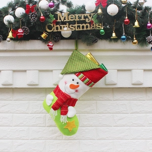 Christmas stocking with snowman and star decor hanging on fireplace mantel decorations