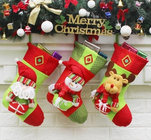 Three hanging Christmas stockings featuring 3D Santa, Snowman and Reindeer characters