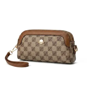 Detailed interior capacity view of a vintage mini crossbody bag with a smartphone