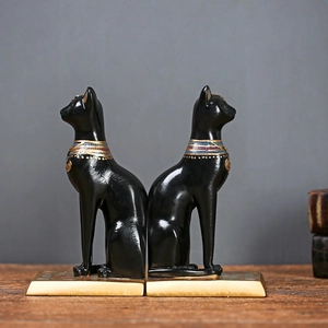 Vintage Egyptische Bastet kat boekensteunen in zwart hars met kleurrijke halsbanden