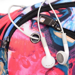 Waterproof sports fanny pack with multi-color print and built-in metal headphone port