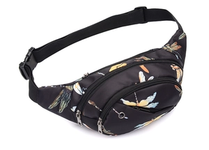 Detail view of black waist bag with dragonfly pattern, multiple pockets and earphone hole