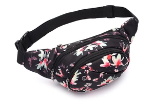 Detail of floral fanny pack showing multiple zipper layers and built-in earphone hole