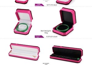 Detail view of velvet jewelry boxes for necklaces and bracelets in fuchsia and purple