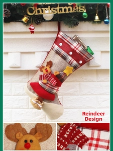 Detail of Christmas stocking with plush reindeer motif and rustic plaid fabric texture