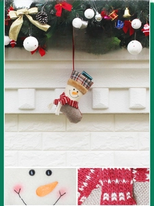 Detail of Christmas stocking featuring a 3D snowman with tartan plaid and faux fur trim