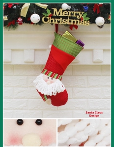Detail of 3D Santa Claus Christmas stocking with handmade yarn beard and gift accents