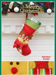 Detail of red knit Christmas stocking featuring a 3D reindeer design and gift fillings