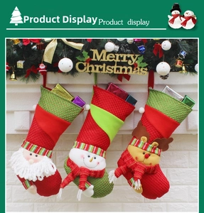 Detailed close-up of Christmas stockings with Santa, Snowman and Reindeer hanging on a wall