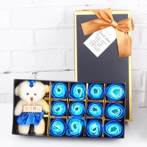 Detail of blue soap rose gift box featuring a cute bear doll and sweet love greeting tag