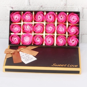 Top view of 18 pink gradient soap roses in a black gift box with gold trim and ribbon