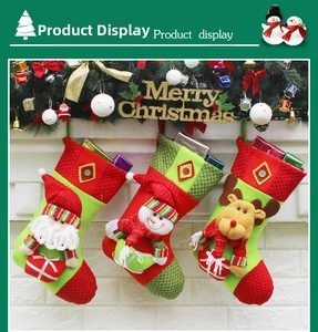 Close-up of three Christmas stockings with 3D Santa, Snowman and Reindeer characters