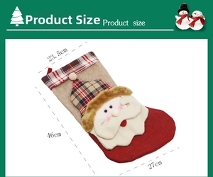 Detailed view of large Santa Claus Christmas stocking dimensions and festive plaid patterns