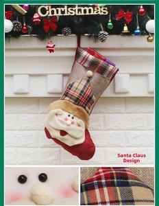 Detail of burlap Santa Christmas stocking with 3D applique and festive gift box