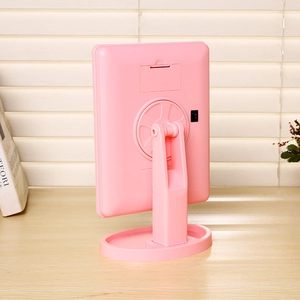 Rear view of pink LED makeup mirror showing battery compartment and power switch