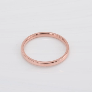 Polished rose gold minimalist band ring for women featuring a sleek mirrored surface finish