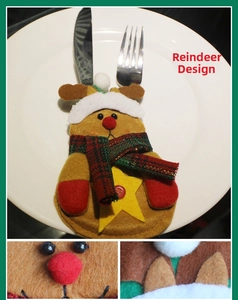 Detail of reindeer felt cutlery holder with red nose, plaid scarf, and star button decor