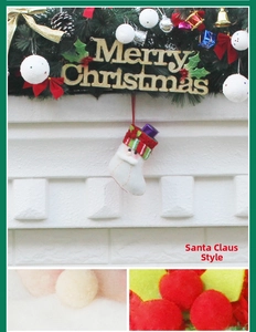 Detail of Santa plush Christmas stocking with knitted textures and white faux fur accents