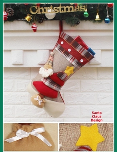 Detail of Christmas stocking with Santa Claus character, plaid fabric, and hanging loop