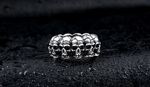 Macro detail of men's gothic skull ring in vintage stainless steel with aged finish