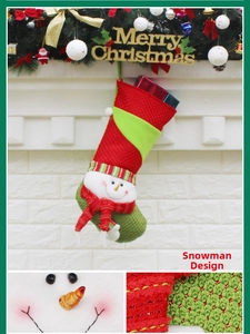 Close-up of a 3D snowman on a red and green knitted Christmas stocking ornament