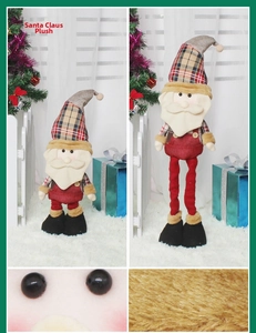 Detail of retractable Santa Claus doll showing adjustable legs and plaid fabric texture