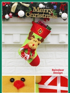 Detail of green Christmas stocking with 3D reindeer applique and red knit accents