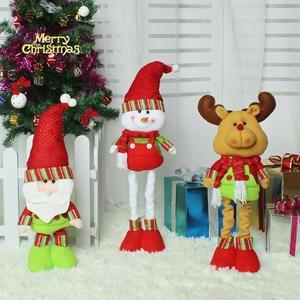 Three plush Christmas dolls featuring Santa, reindeer and snowman with retractable long legs