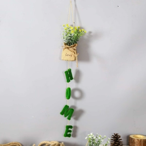 Hanging burlap bag with yellow flowers and green flocked HOME letters wall decor