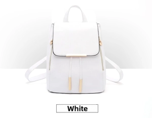 Detailed view of white litchi pattern PU leather backpack with gold metal trim and drawstring