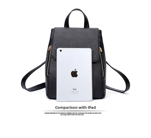 Compact black crossgrain PU backpack shown next to an iPad mini for size comparison