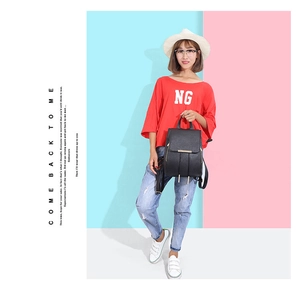 Fashionable black PU leather backpack with gold zippers shown on model for daily use