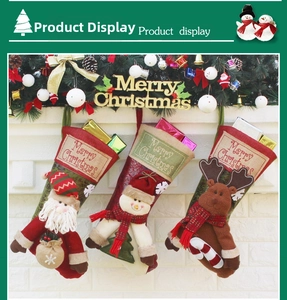 Detailed view of large Christmas stockings with 3D Santa, Snowman and Reindeer characters