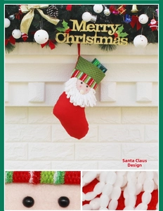 Detail of a Santa Claus Christmas stocking with woven beard and festive green gift inserts