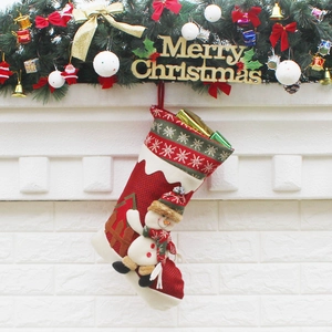 Christmas stocking with snowman 3D doll hanging on fireplace for home holiday decoration