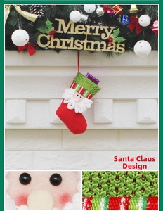 Detailed view of Santa Claus face design on a red and green knitted Christmas stocking