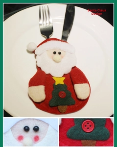Detail of Santa felt cutlery holder with green tree patch for Christmas table decor