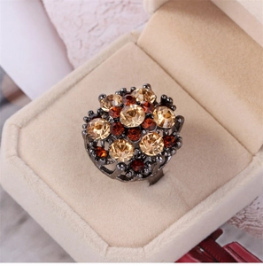Macro detail of vintage floral ring with champagne zircons and grey metal finish