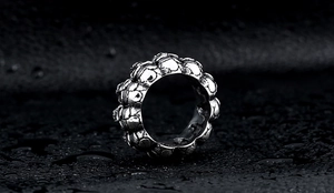 Macro shot of a retro stainless steel punk skull ring with black vintage oxidized finish