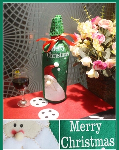 Detail of Christmas wine bottle cover with sequin embroidery and Merry Christmas text