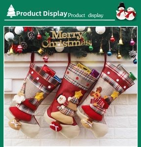 Three Christmas stockings with Santa, Snowman, and Reindeer hung on white brick wall