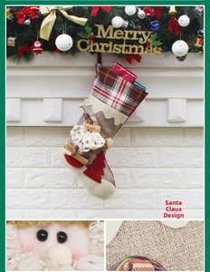 Detail of Santa Claus plush stocking with red plaid and burlap fabric texture